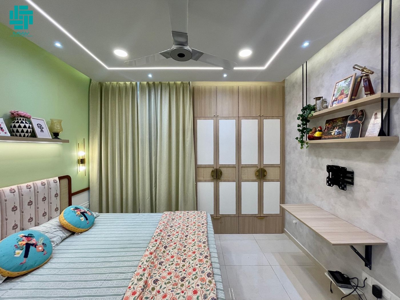 Bedroom with sage green walls and cove lighting