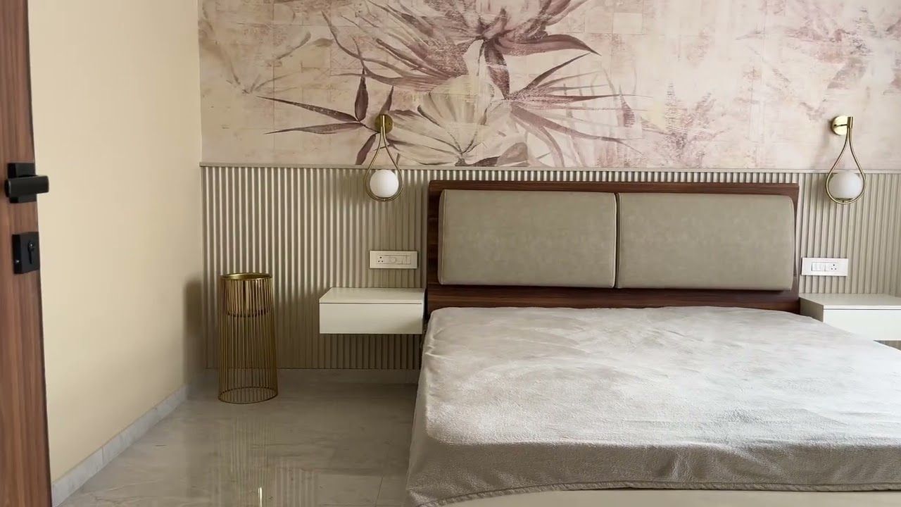 Bedroom with botanical wallpaper and upholstered headboard
